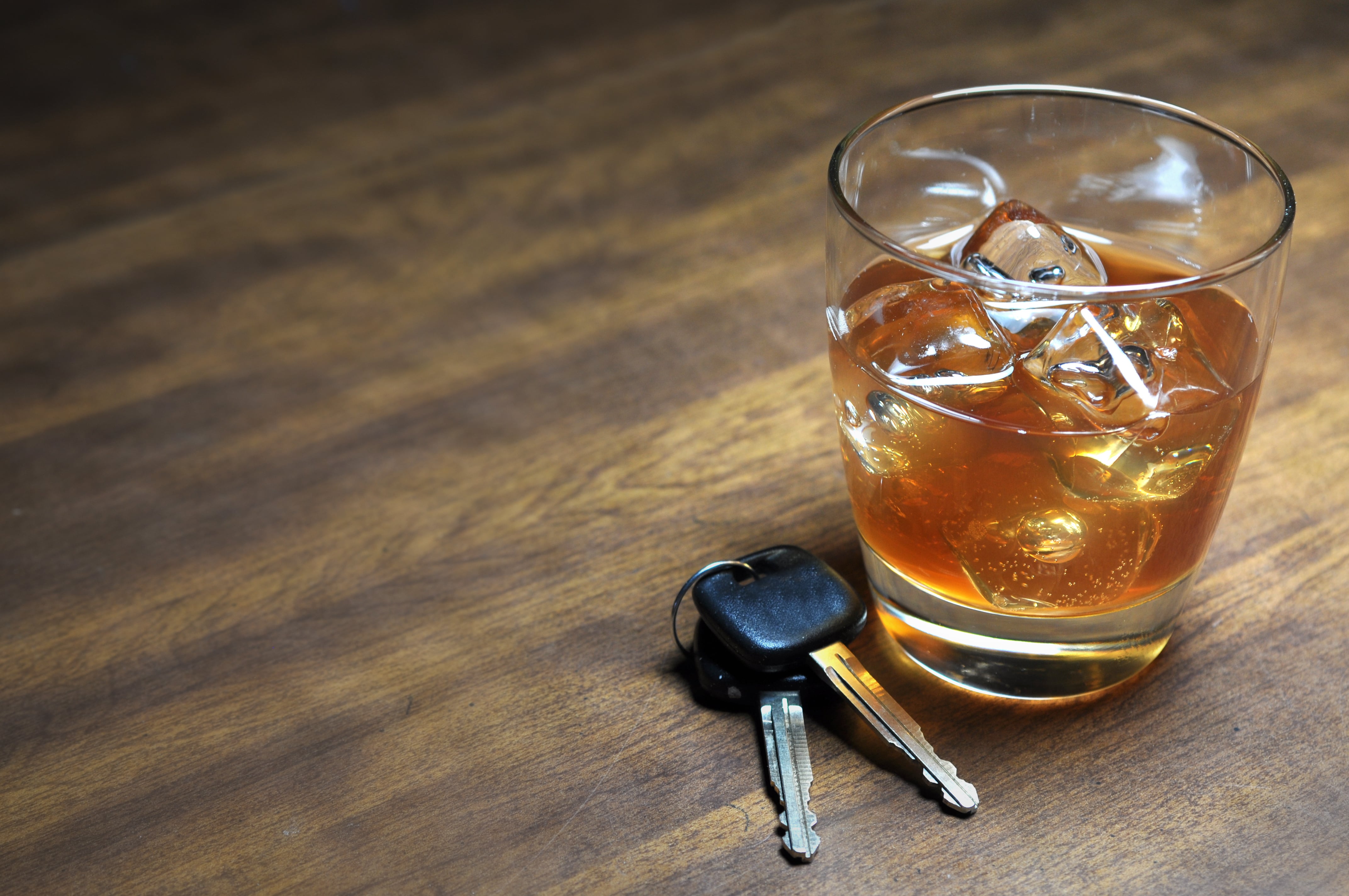 car keys next to alcoholic drink